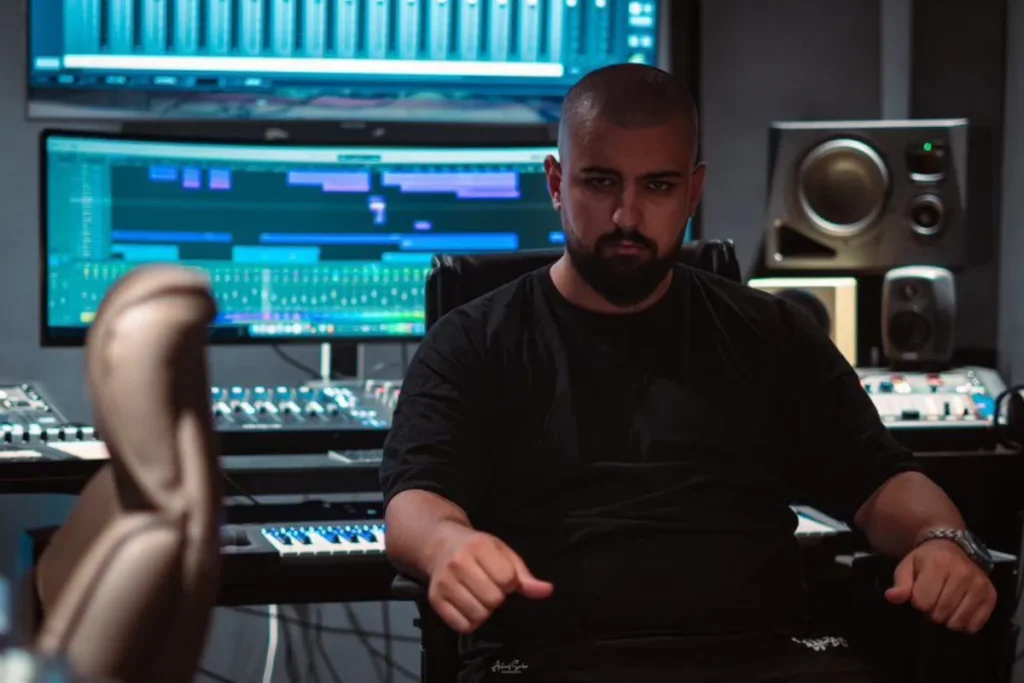 MixByJonah: The First FL Studio Certified Trainer in Africa Producer Jonah posing at a studio during the filming the music video of “Cash & Flow” project by CIH bank