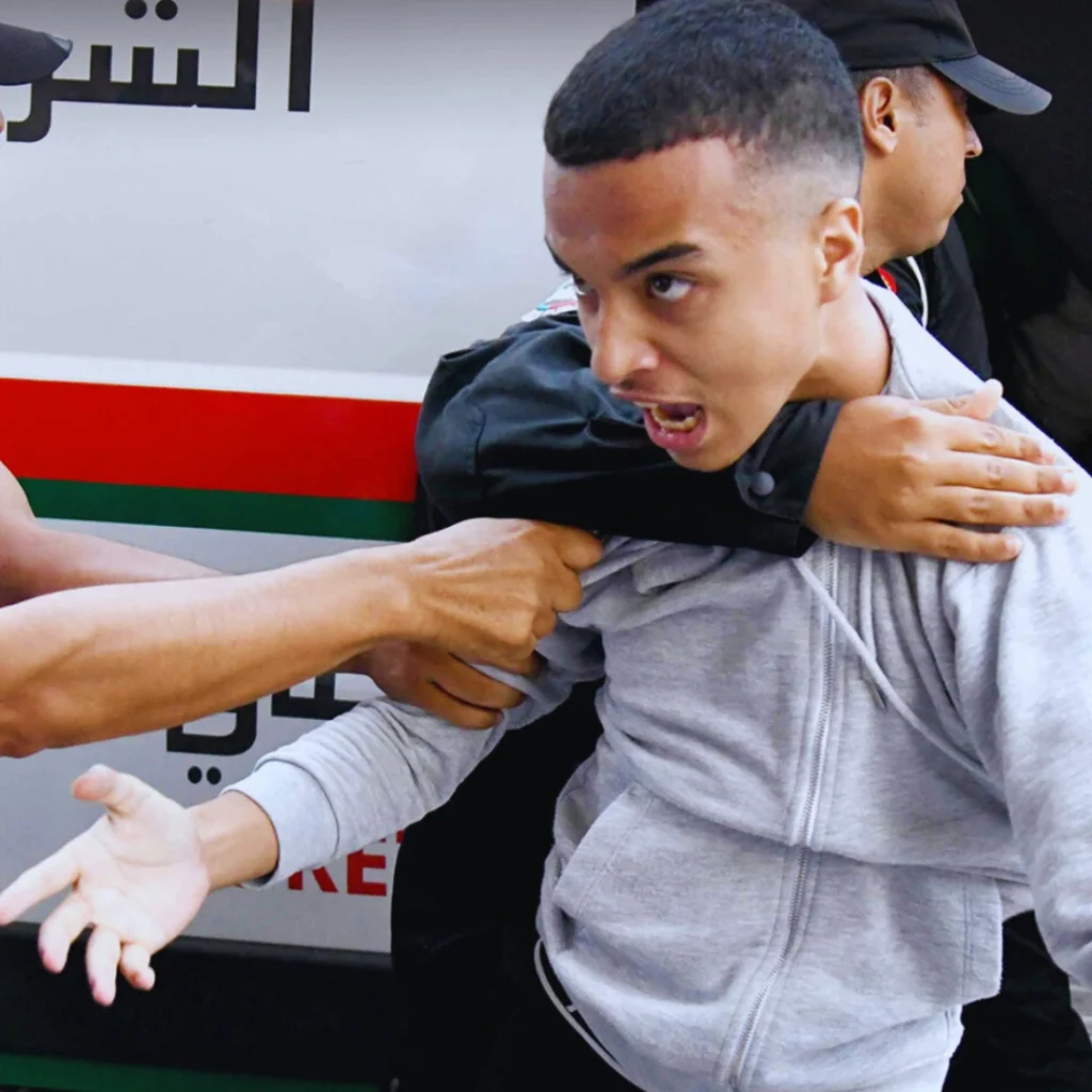 Image from the GenZ212 Protests in Morocco, arresting a journalist