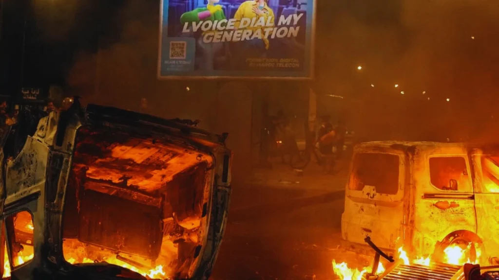 photograph captures a stark contradiction the violent reality of burning vehicles during the GenZ protests