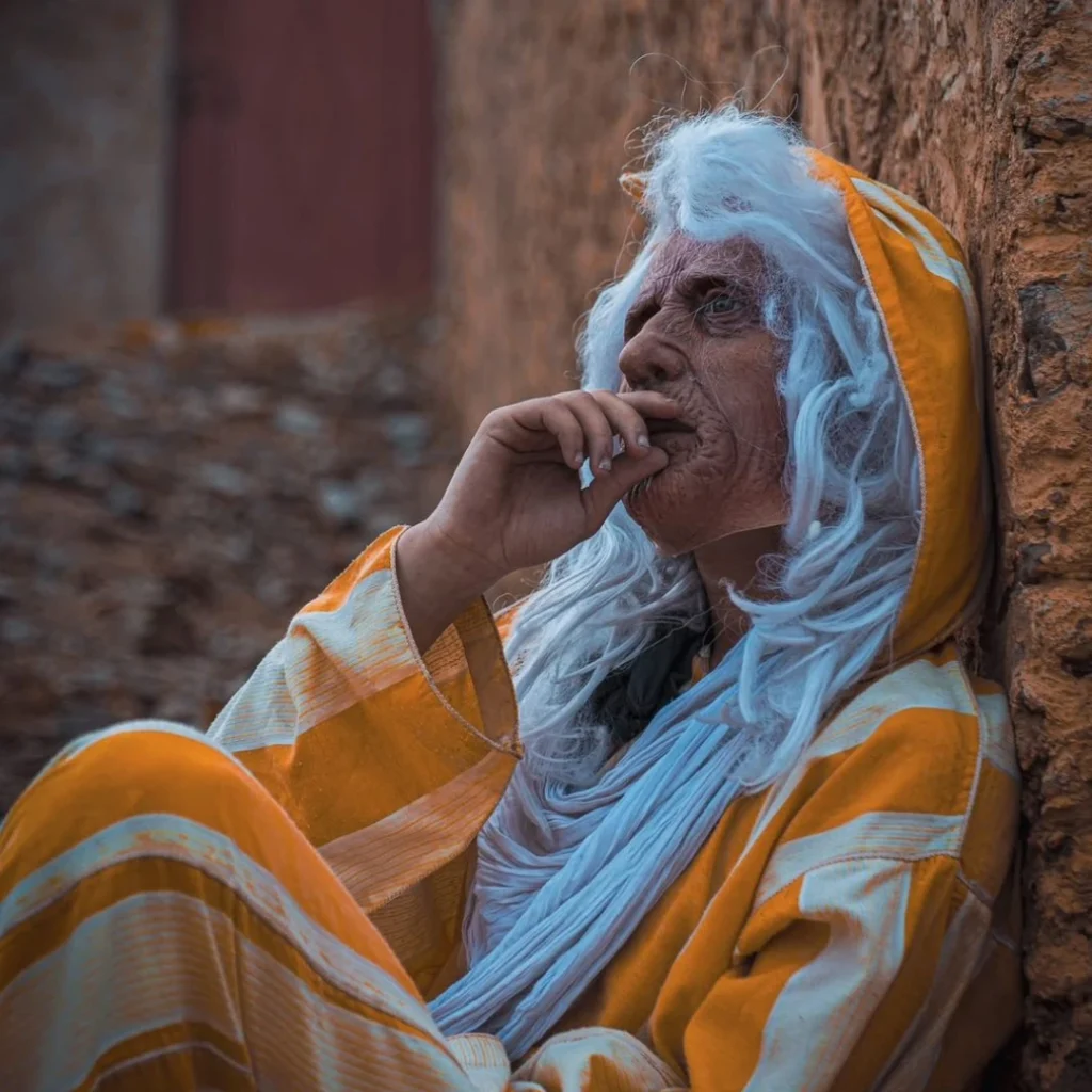 Still from Overman's Music Video Toqosi of an old man smoking
